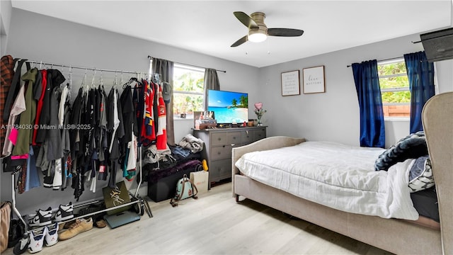 6582 SW 20th St, North Lauderdale, FL 33068 - bedroom with wood finished floors, multiple windows, and a ceiling fan
