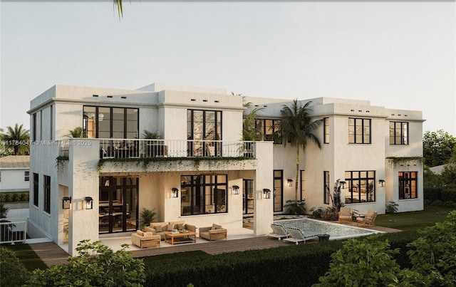 1259 NE 97th St, Miami Shores, FL 33138 - back of property with a balcony, an outdoor living space, a patio, and stucco siding