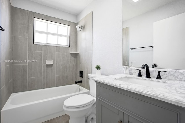 full bathroom with toilet, tub / shower combination, and vanity