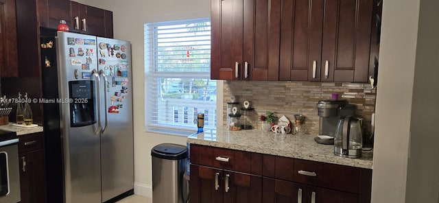 431 SE 3rd St Unit 205, Dania Beach, FL 33004 - kitchen featuring dark brown cabinets, decorative backsplash, stainless steel fridge, and baseboards