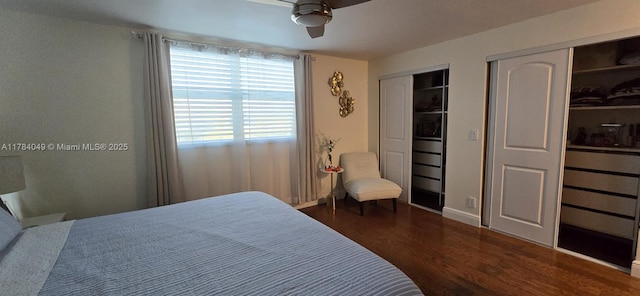 431 SE 3rd St Unit 205, Dania Beach, FL 33004 - bedroom featuring two closets, baseboards, a ceiling fan, and wood finished floors
