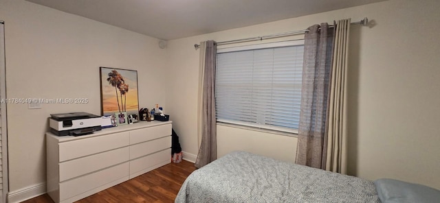 431 SE 3rd St Unit 205, Dania Beach, FL 33004 - bedroom featuring baseboards and dark wood-style floors