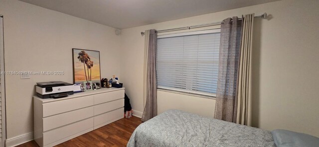 431 SE 3rd St Unit 205, Dania Beach, FL 33004 - bedroom featuring dark wood finished floors and baseboards