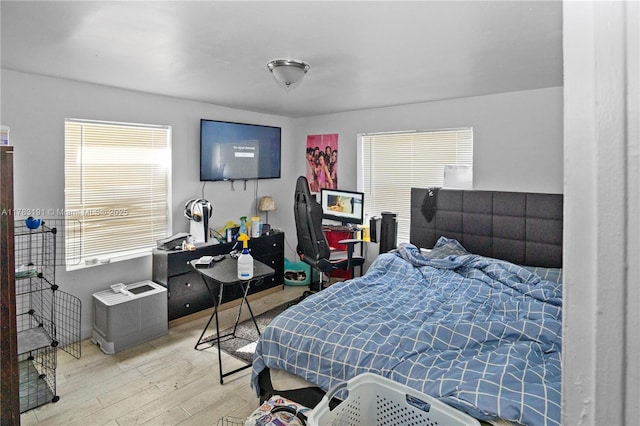 bedroom with wood finished floors