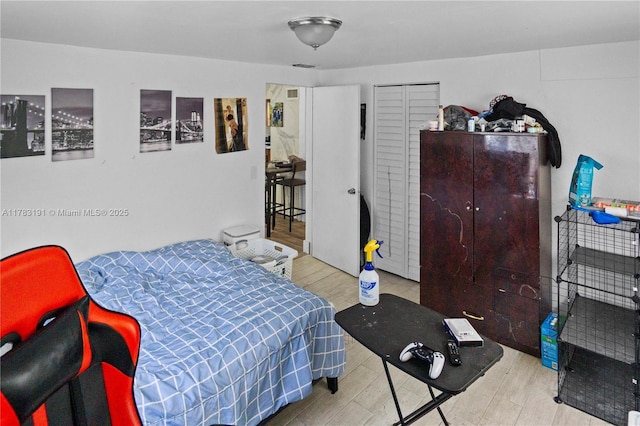 bedroom featuring wood finished floors