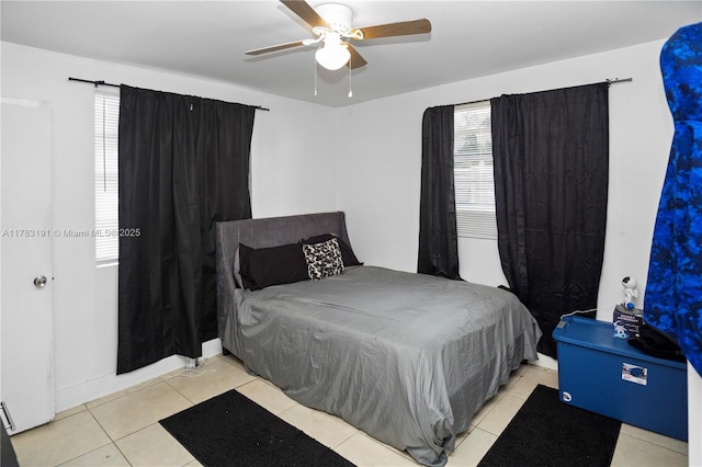 bedroom featuring ceiling fan and light tile patterned flooring