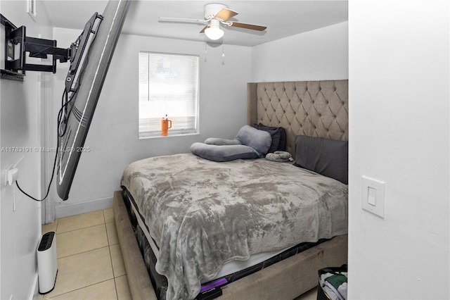 bedroom with light tile patterned flooring and a ceiling fan
