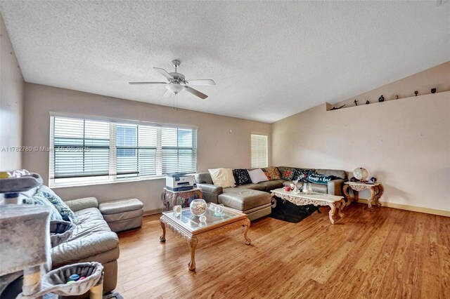 7324 NW 1st Pl, Plantation, FL 33317 - living room featuring a textured ceiling, wood finished floors, baseboards, and a ceiling fan