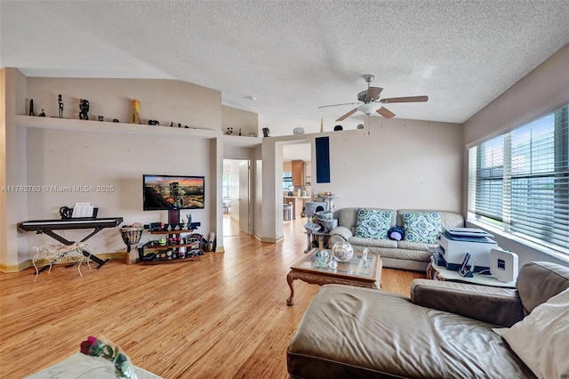 7324 NW 1st Pl, Plantation, FL 33317 - living area featuring a ceiling fan, lofted ceiling, wood finished floors, and a textured ceiling