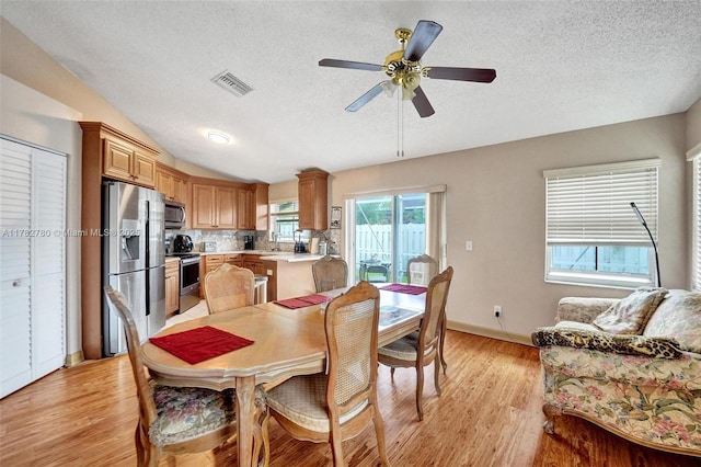 7324 NW 1st Pl, Plantation, FL 33317 - dining area with light wood finished floors, visible vents, a textured ceiling, and a ceiling fan