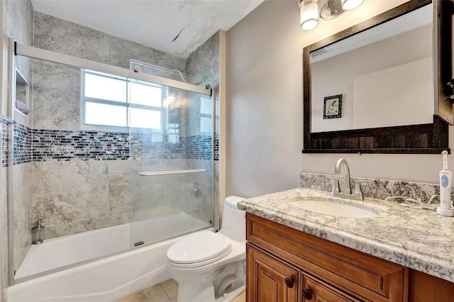 7324 NW 1st Pl, Plantation, FL 33317 - full bathroom with tile patterned flooring, enclosed tub / shower combo, vanity, and toilet