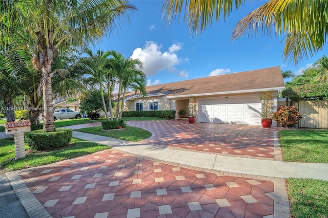 4991 NW 72nd Ter, Lauderhill, FL 33319 - view of front of home featuring a garage and decorative driveway