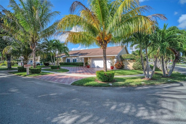 4991 NW 72nd Ter, Lauderhill, FL 33319 - single story home featuring an attached garage and decorative driveway