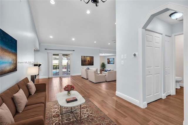 4991 NW 72nd Ter, Lauderhill, FL 33319 - living area with crown molding, baseboards, recessed lighting, and wood finished floors