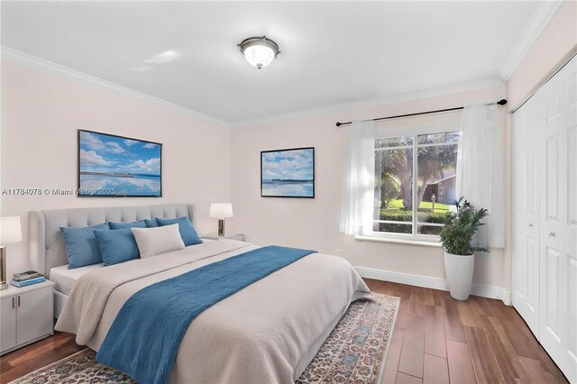 4991 NW 72nd Ter, Lauderhill, FL 33319 - bedroom with baseboards, ornamental molding, and wood finished floors
