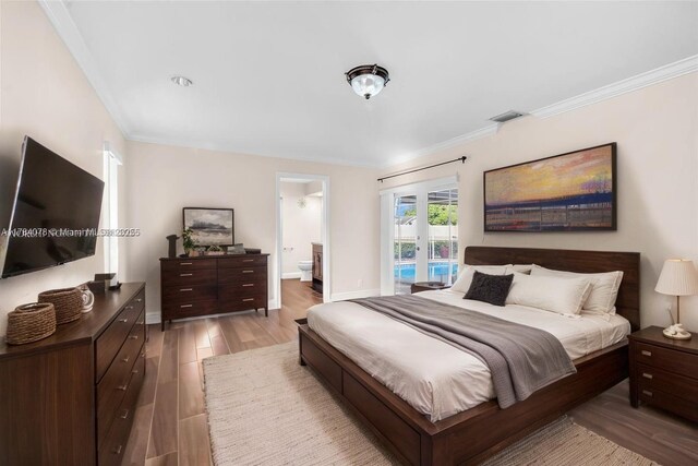 4991 NW 72nd Ter, Lauderhill, FL 33319 - bedroom featuring visible vents, light wood finished floors, and crown molding