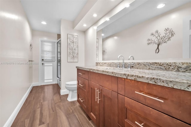 4991 NW 72nd Ter, Lauderhill, FL 33319 - bathroom featuring a shower with shower door, vanity, toilet, recessed lighting, and baseboards