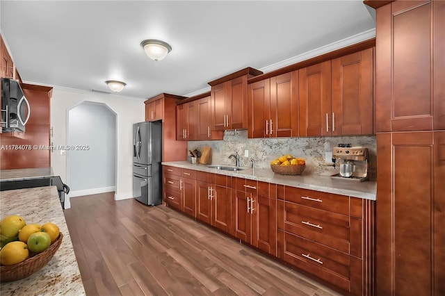 4991 NW 72nd Ter, Lauderhill, FL 33319 - kitchen with decorative backsplash, dark wood-style flooring, crown molding, a sink, and stainless steel appliances