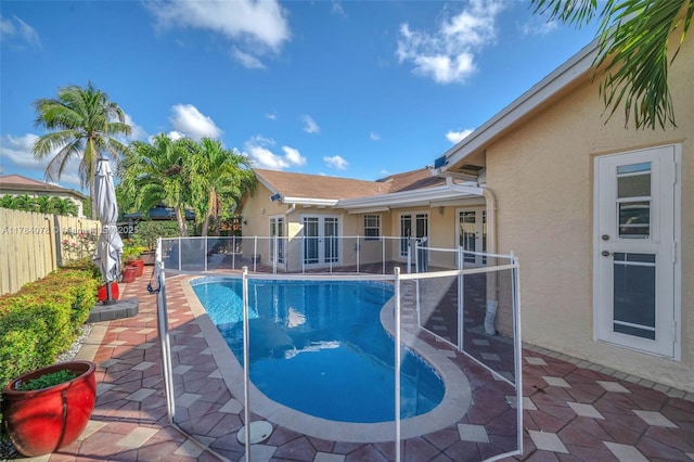 4991 NW 72nd Ter, Lauderhill, FL 33319 - view of pool with fence, french doors, a patio area, and a fenced in pool