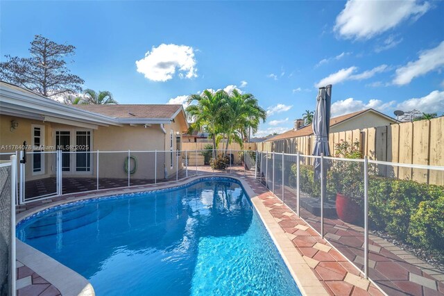 4991 NW 72nd Ter, Lauderhill, FL 33319 - view of swimming pool with a fenced in pool and a fenced backyard