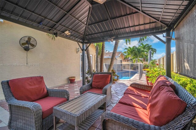 4991 NW 72nd Ter, Lauderhill, FL 33319 - view of patio featuring a fenced backyard, a fenced in pool, a gazebo, and an outdoor living space