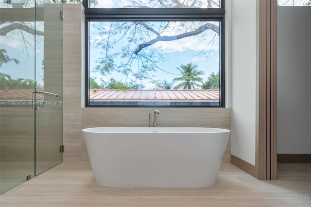 510 NE 52nd St, Miami, FL 33137 - bathroom with a freestanding tub and healthy amount of natural light