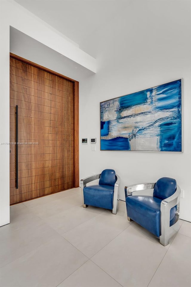 sitting room featuring tile patterned floors