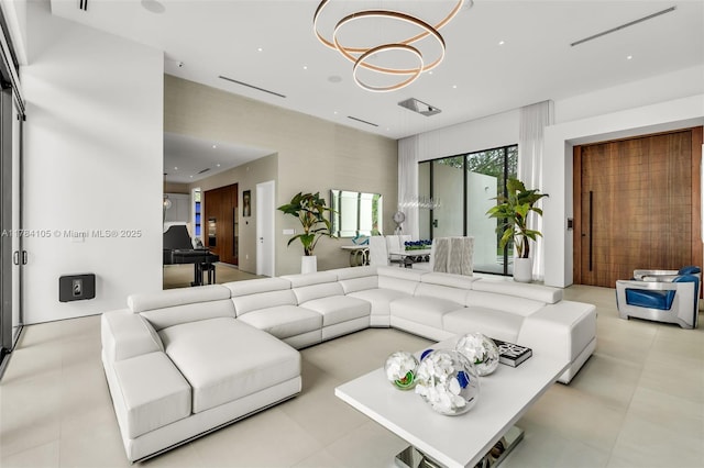 living area with recessed lighting and a chandelier