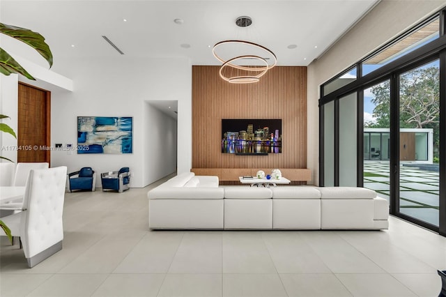 tiled living room featuring a high ceiling