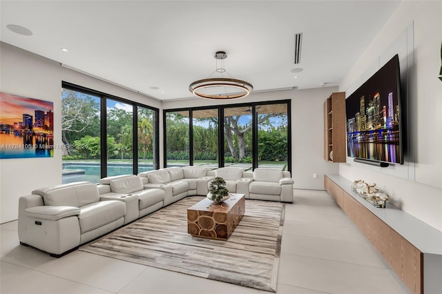 living room with light tile patterned floors and plenty of natural light