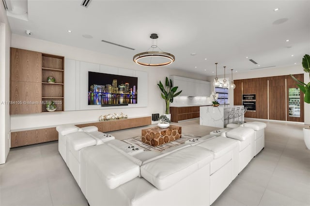 living area with light tile patterned floors and recessed lighting