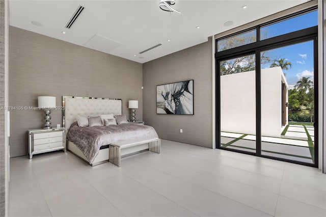bedroom featuring access to outside and a high ceiling