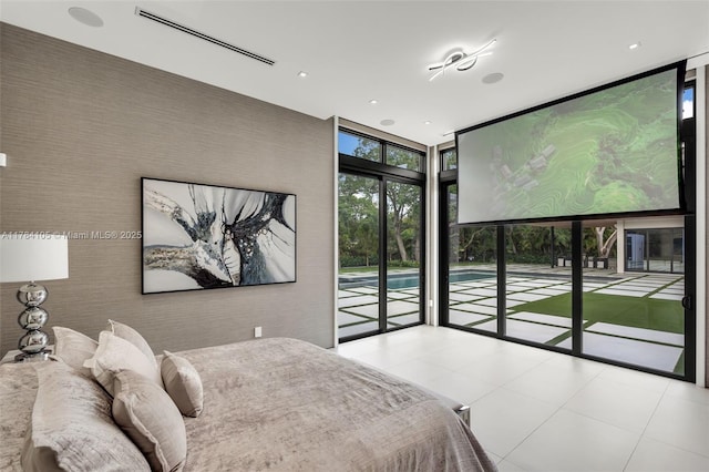 bedroom with a wall of windows, access to outside, tile patterned floors, and recessed lighting