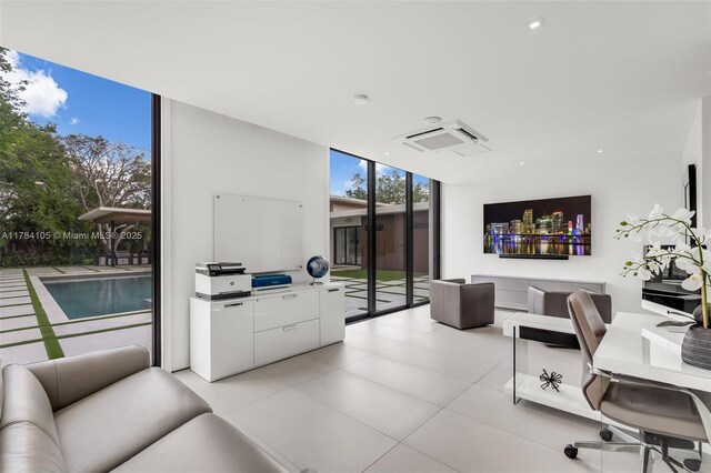 living room with expansive windows, light tile patterned flooring, and recessed lighting