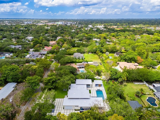 aerial perspective of suburban area featuring a pool