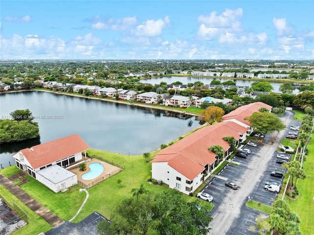 bird's eye view featuring a residential view and a water view