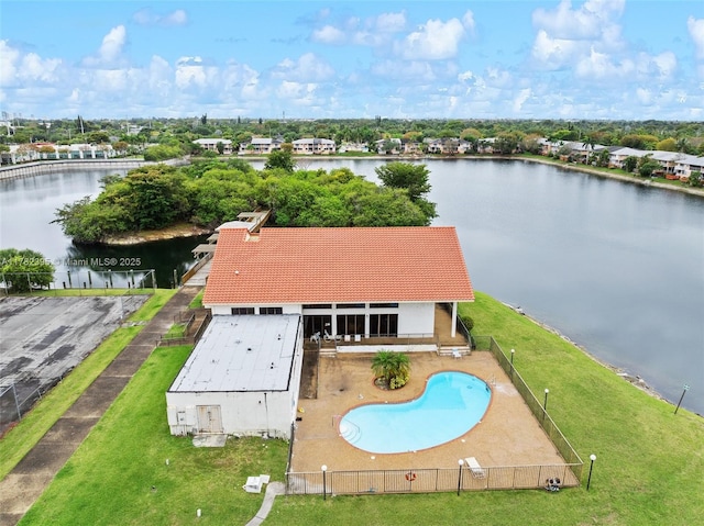 birds eye view of property with a water view
