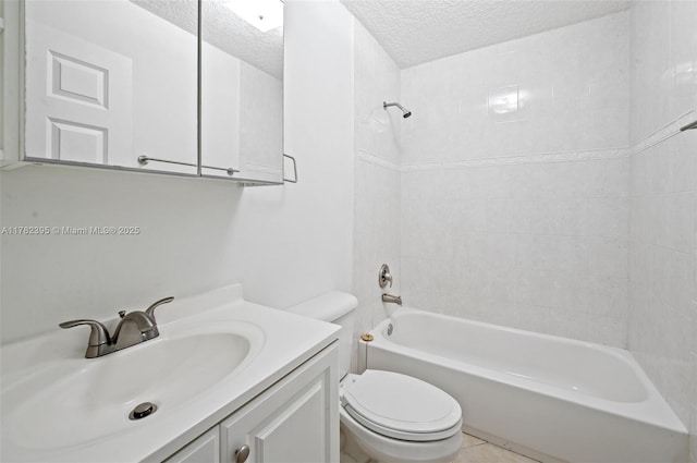 bathroom featuring bathtub / shower combination, vanity, a textured ceiling, and toilet