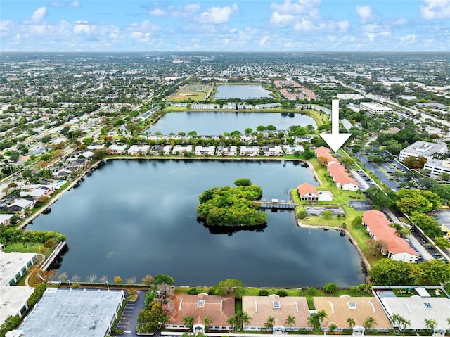 birds eye view of property featuring a water view and a residential view