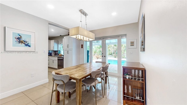 8435 SW 157th St, Palmetto Bay, FL 33157 - dining area with baseboards, an inviting chandelier, recessed lighting, french doors, and light tile patterned flooring