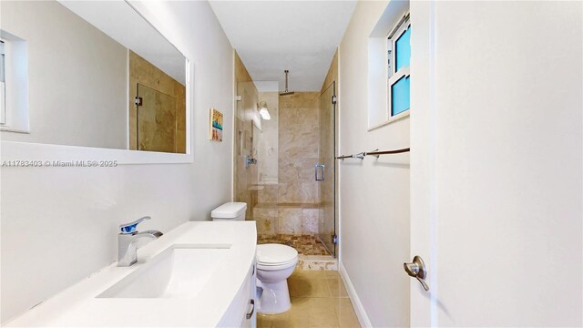 8435 SW 157th St, Palmetto Bay, FL 33157 - bathroom featuring vanity, baseboards, tile patterned floors, toilet, and a shower stall