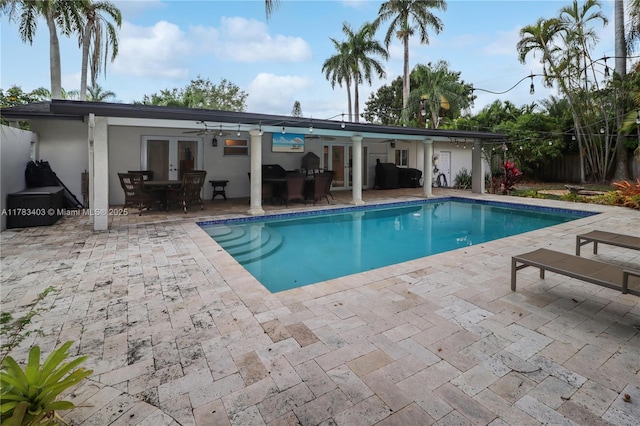 8435 SW 157th St, Palmetto Bay, FL 33157 - outdoor pool with french doors, ceiling fan, and a patio area