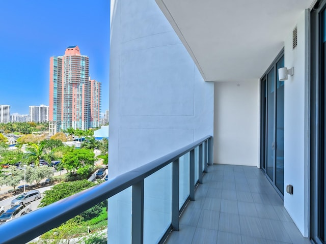 balcony featuring visible vents and a view of city
