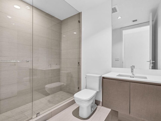 full bathroom with visible vents, toilet, a stall shower, and vanity