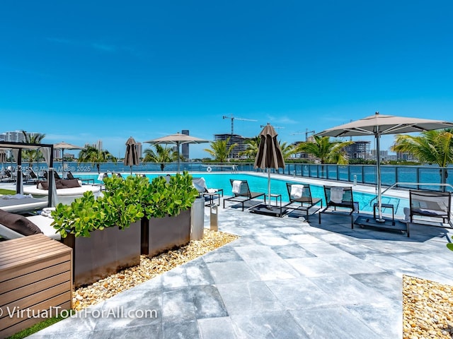 pool featuring a patio area