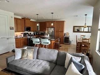 3142 NW 124th Way, Sunrise, FL 33323 - living room featuring baseboards