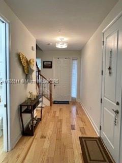 3142 NW 124th Way, Sunrise, FL 33323 - entryway with light wood finished floors and baseboards