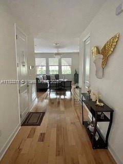 3142 NW 124th Way, Sunrise, FL 33323 - corridor with wood finished floors and baseboards