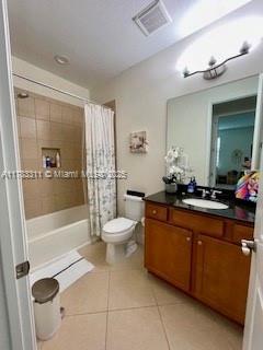 3142 NW 124th Way, Sunrise, FL 33323 - full bath featuring vanity, tile patterned flooring, shower / bath combination with curtain, and toilet