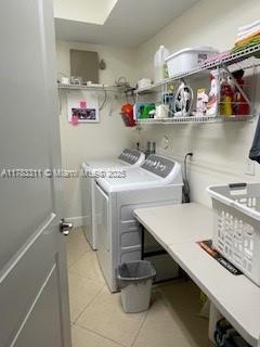 3142 NW 124th Way, Sunrise, FL 33323 - washroom featuring independent washer and dryer and light tile patterned floors